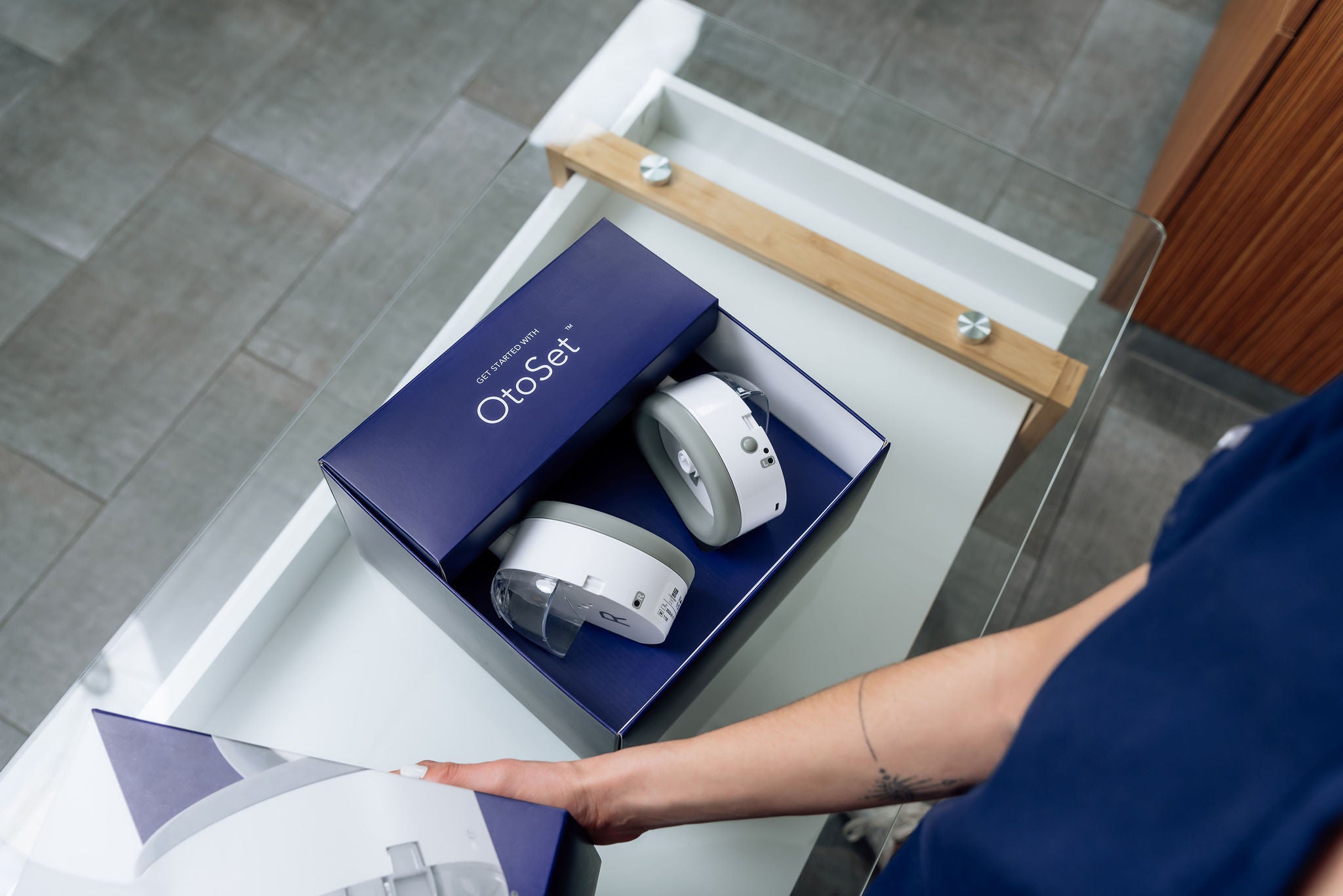 OtoSet automated ear cleaning system looks like a pair of headphones